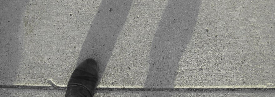 feet on a sidewalk